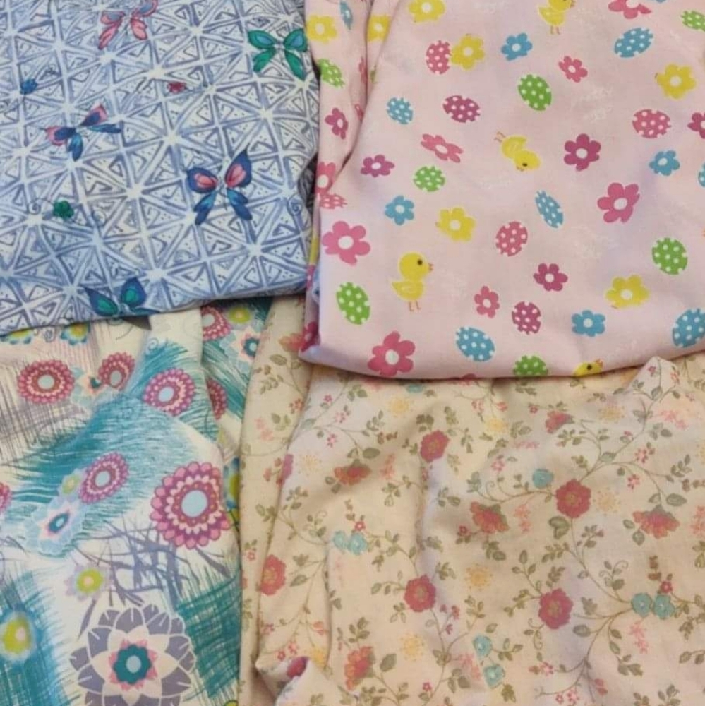 Bundle of four scrub tops size 2XL.